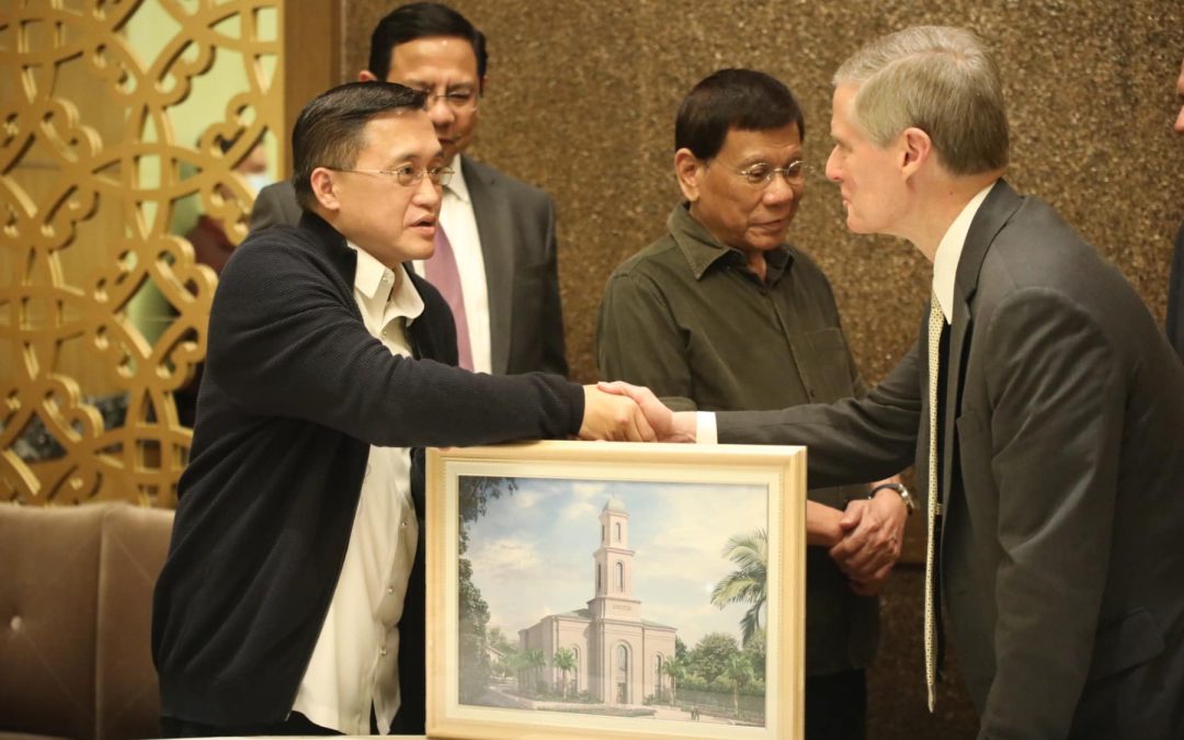 Senator Bong Go and former President Duterte meet with Elder Bednar in presenting the painting of the Davao Temple