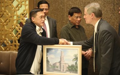 Senator Bong Go and former President Duterte meet with Elder Bednar in presenting the painting of the Davao Temple